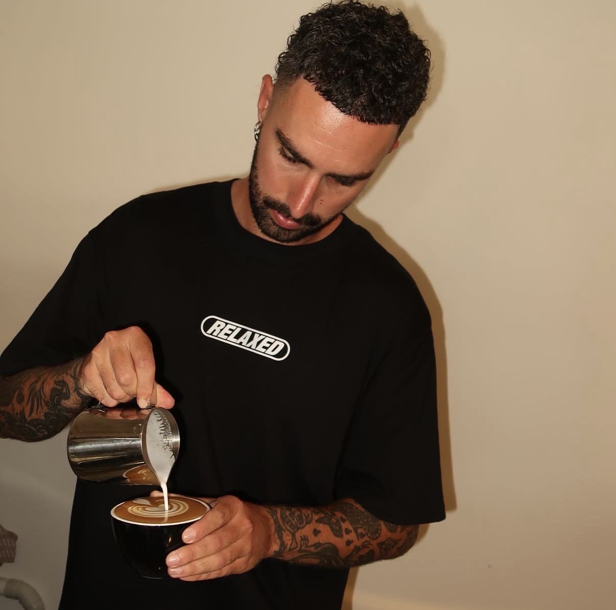 Josh in the Relaxed tee pouring latte art